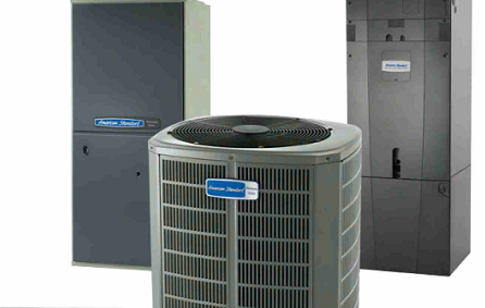 A group of three air conditioners sitting next to each other.